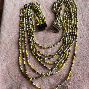 VTG 8 STRAND YELLOW WHITE AND BROWN GLASS SEED BEADED WOODEN. BUCKLE NECKLACE